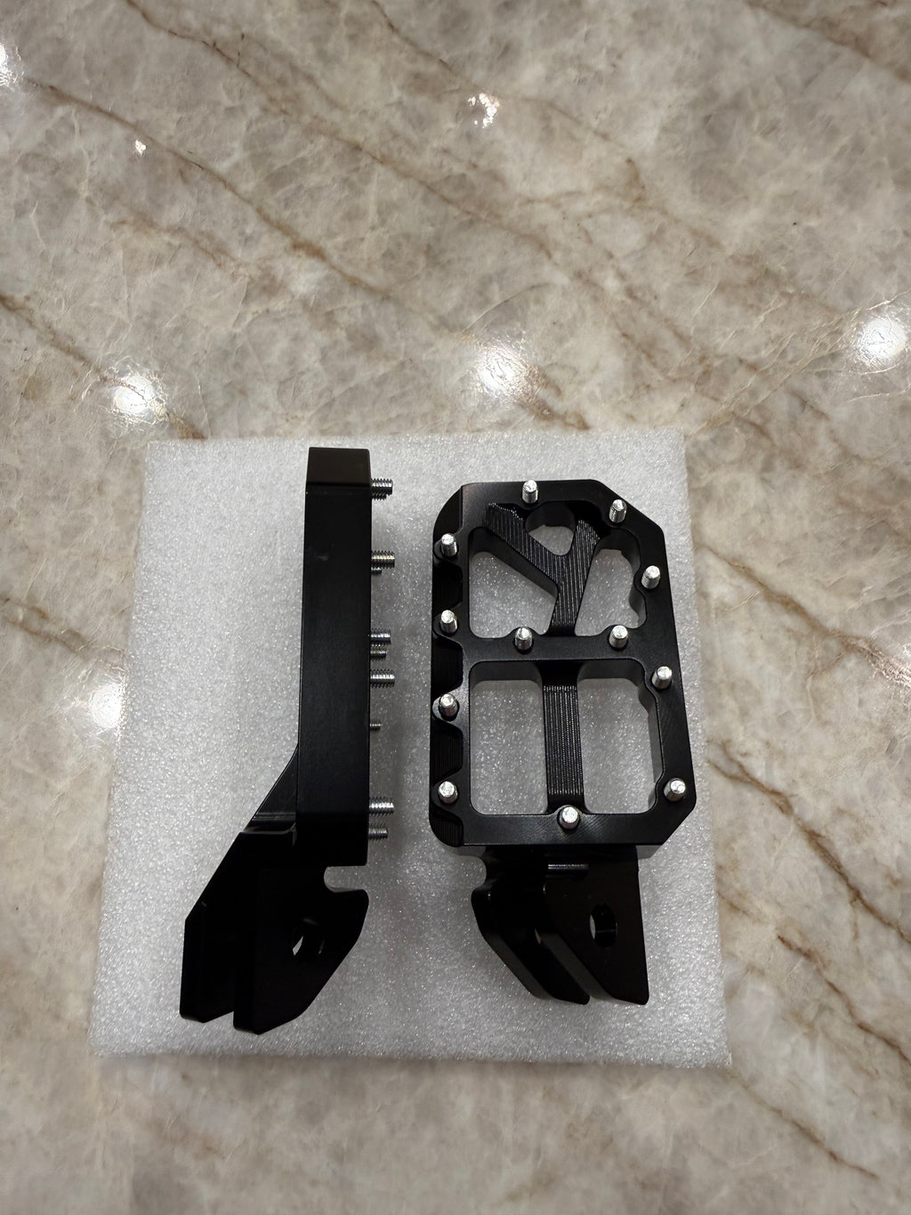E-Moto titanium foot pegs